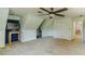 Large bonus room with neutral colored carpet and a ceiling fan at 4989 Woodfall Sw Dr, Lilburn, GA 30047
