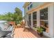 Inviting wooden deck with a grill, chair, and potted plants, creating a cozy outdoor space at 4989 Woodfall Sw Dr, Lilburn, GA 30047