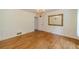Bright dining room featuring hardwood floors, elegant wainscoting, and chandelier at 4989 Woodfall Sw Dr, Lilburn, GA 30047