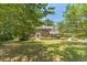 Traditional brick home with well-maintained landscaping and a lush green lawn at 4989 Woodfall Sw Dr, Lilburn, GA 30047
