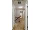Upstairs hallway with neutral carpet and doors at 4989 Woodfall Sw Dr, Lilburn, GA 30047