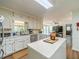 Bright kitchen featuring white cabinets and stainless steel appliances at 4989 Woodfall Sw Dr, Lilburn, GA 30047