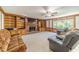 Spacious living room features a fireplace, built-in shelves, and plush seating at 4989 Woodfall Sw Dr, Lilburn, GA 30047