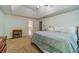 Bright main bedroom featuring a trey ceiling, carpet and ensuite bathroom at 4989 Woodfall Sw Dr, Lilburn, GA 30047