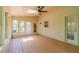Light-filled sunroom featuring wood flooring, lots of windows, and a door at 4989 Woodfall Sw Dr, Lilburn, GA 30047