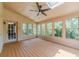Bright sunroom with wood floors, multiple windows, a skylight and a ceiling fan at 4989 Woodfall Sw Dr, Lilburn, GA 30047