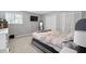 Comfortable bedroom features natural light, closet, and neutral carpet at 102 Oak Pl, Villa Rica, GA 30180