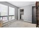Bright bedroom with large window, carpet, and closet at 102 Oak Pl, Villa Rica, GA 30180
