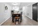 Open-concept dining area with a stylish table and chairs, seamlessly connecting to the kitchen at 102 Oak Pl, Villa Rica, GA 30180
