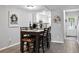 Inviting dining space featuring an adjacent view of the kitchen, ideal for meals and gatherings at 102 Oak Pl, Villa Rica, GA 30180