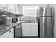 Efficient kitchen with white cabinets, granite countertops, and stainless steel appliances at 102 Oak Pl, Villa Rica, GA 30180