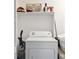 Dedicated laundry closet with a white dryer and storage space at 102 Oak Pl, Villa Rica, GA 30180