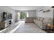 Bright living room featuring a comfortable sectional sofa and sliding glass doors to the outside at 102 Oak Pl, Villa Rica, GA 30180