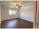 Bedroom with dark laminate floors, neutral walls, bright window and a ceiling fan at 2285 Peachtree Ne Rd # 1202, Brookhaven, GA 30309