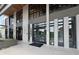 Commercial building entryway with black framed windows, glass doors and a cement exterior at 2285 Peachtree Ne Rd # 1202, Brookhaven, GA 30309