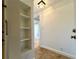 Entryway area with decorative tiled floors, bright lighting and a built-in shelving unit at 2285 Peachtree Ne Rd # 1202, Brookhaven, GA 30309