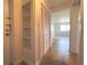 Hallway area with neutral walls, decorative tiled floors and a built-in shelving unit at 2285 Peachtree Ne Rd # 1202, Brookhaven, GA 30309
