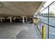 Secured parking garage featuring ample spaces under a solid concrete ceiling, ensuring vehicle protection and convenient access at 2285 Peachtree Ne Rd # 1202, Brookhaven, GA 30309