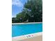 Outdoor swimming pool surrounded by greenery and lounge chairs at 2285 Peachtree Ne Rd # 1202, Brookhaven, GA 30309