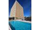 Modern high-rise building overlooking a sparkling swimming pool at 2285 Peachtree Ne Rd # 1202, Brookhaven, GA 30309