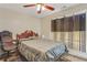 Comfortable bedroom with ample natural light, a ceiling fan, and neutral color palette at 12303 Waldrop Pl, Decatur, GA 30034