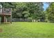 Spacious backyard and lush landscaping; the perfect place to entertain and play at 304 Bennett Farms Ct, Acworth, GA 30102