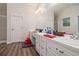 Modern bathroom featuring double sinks, wood-look floors, and recessed lighting at 304 Bennett Farms Ct, Acworth, GA 30102