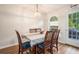 Cozy dining area with wood floors and a view of the outdoor deck at 304 Bennett Farms Ct, Acworth, GA 30102