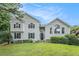 Charming home with white siding, dark shutters, and a well-manicured lawn at 304 Bennett Farms Ct, Acworth, GA 30102