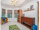 Bright playroom featuring a chandelier, natural light, and built-in shelving at 304 Bennett Farms Ct, Acworth, GA 30102