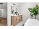 Stylish bathroom features a double vanity, large mirror, sleek decor, and freestanding tub for a spa-like feel at 951 Reed Ave, Atlanta, GA 30344