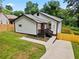 Well-manicured yard highlights the charm of this home and its inviting curb appeal at 951 Reed Ave, Atlanta, GA 30344