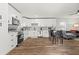 Bright, updated kitchen featuring white cabinets, stainless steel appliances, dining area and open-concept view of the living room at 951 Reed Ave, Atlanta, GA 30344