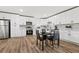 Updated kitchen with white cabinets, stainless steel appliances, modern fixtures, and an adjacent dining area at 951 Reed Ave, Atlanta, GA 30344