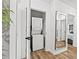 Conveniently located laundry area equipped with a stacked washer and dryer, maximizing space efficiency at 951 Reed Ave, Atlanta, GA 30344