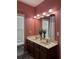 Bathroom with double sink vanity, large mirror, and modern lighting fixtures at 4210 Chatham Ridge Drive Dr, Buford, GA 30518