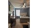 Cozy bedroom featuring a ceiling fan, and a dedicated workspace with a desk at 4210 Chatham Ridge Drive Dr, Buford, GA 30518