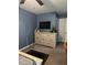 Bedroom with a TV, closet, and dresser at 4210 Chatham Ridge Drive Dr, Buford, GA 30518