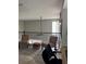 Upstairs bonus room with wood-look floors and black metal railings at 4210 Chatham Ridge Drive Dr, Buford, GA 30518