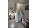 Stylish entryway featuring hard surface floors, stairs, a decorative table, and elegant decor at 4210 Chatham Ridge Drive Dr, Buford, GA 30518