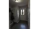 Functional entryway with hardwood flooring, coat rack, front door with sidelights, and storage at 4210 Chatham Ridge Drive Dr, Buford, GA 30518