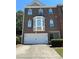 Charming two-story brick home with an attached two car garage and well maintained landscaping at 4210 Chatham Ridge Drive Dr, Buford, GA 30518