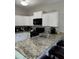 Well-lit kitchen with granite countertops, white cabinets, and stainless steel appliances at 4210 Chatham Ridge Drive Dr, Buford, GA 30518