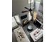 Bright living room with a fireplace, ceiling fan, many windows, and hardwood floors at 4210 Chatham Ridge Drive Dr, Buford, GA 30518