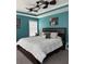 Comfortable bedroom with a large bed, overhead fan, ample natural light, and modern decor at 4210 Chatham Ridge Drive Dr, Buford, GA 30518