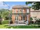Exterior view of the brick house featuring a patio, bench seating, and a well-maintained yard at 5575 Julian Pl, Atlanta, GA 30342