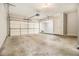 Spacious garage area with a working door, high ceilings, and an additional storage area at 5575 Julian Pl, Atlanta, GA 30342
