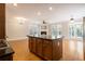 Open concept kitchen features a center island, gas range, granite counters, and adjacent living area at 5575 Julian Pl, Atlanta, GA 30342