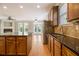 Updated kitchen with a central island, granite countertops, stainless steel appliances, and wood cabinetry at 5575 Julian Pl, Atlanta, GA 30342