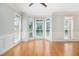 Bright living room with hardwood floors, neutral paint, and large windows at 5575 Julian Pl, Atlanta, GA 30342